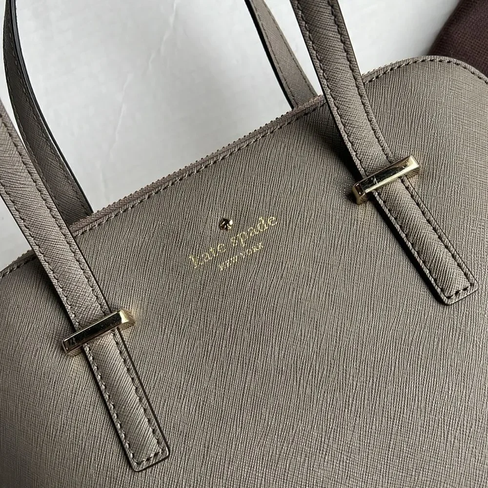 Kate Spade Cedar Street Maise Satchel in a shade of grey or taupe.